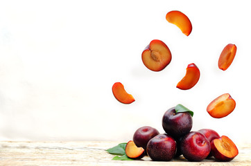 plums with flying slices