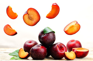 plums with flying slices
