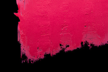 Smudged lipstick pink on a black isolated background