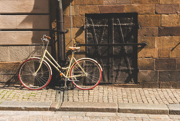 A vintage bicycle chained to a pole in Stockholm Sweden. 