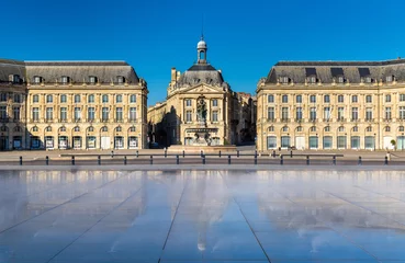 Fotobehang Famous water mirror fountain in front of Place de la Bourse in Bordeaux, France © Leonid Andronov