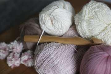 Fototapeta na wymiar White and Pink Yarn with Wooden Knitting Crochet Needle