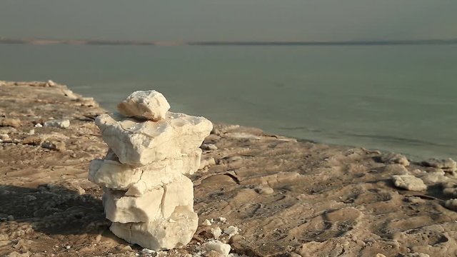 Salt on the shore of Dead Sea in Jordan. White salt deposits of Dead Sea