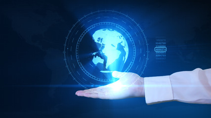 A businessman is holding a hologram of planet earth in his hand. Futuristic interface