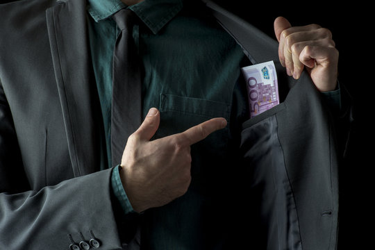 Conceptual image of businessman showing money