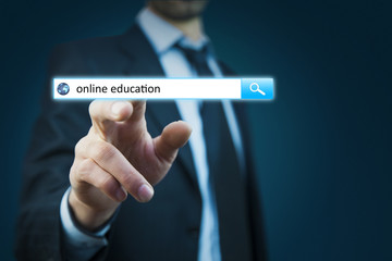 man hand touching online education text