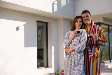 Young beautiful couple in bathrobes