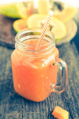 Papaya smoothie in glass jar