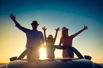 Silhouette of happy family at the beach