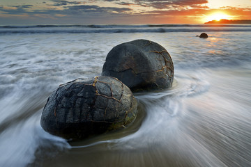 A pair of moeraki boulders in New Zealand.