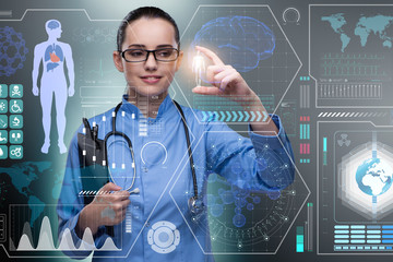 Doctor in futuristic medical concept pressing button