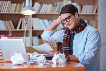 Young book writer writing in library