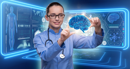 Female doctor with the brain in medical concept