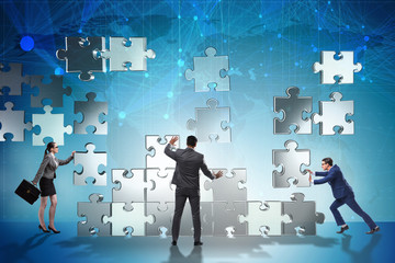 Business concept of teamwork with puzzle pieces