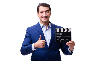 Handsome man with movie clapper isolated on white