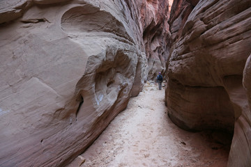 A hiker in Buckskin Gulch, located in southern Utah, it is one of the longest slot canyons in the world.