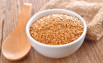 flax seeds heap in bowl on a tabel