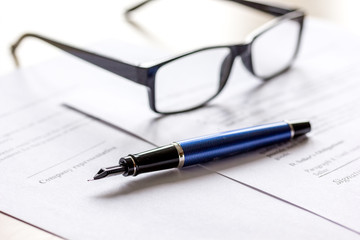 Fototapeta premium businessman office desk with contract for signig, glasses and pen