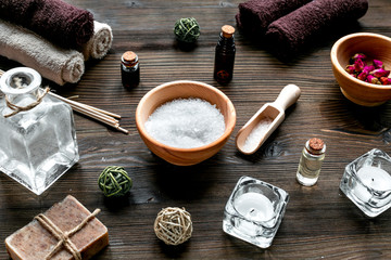 Fototapeta na wymiar bathroom salt and natural soap for spa on wooden table background