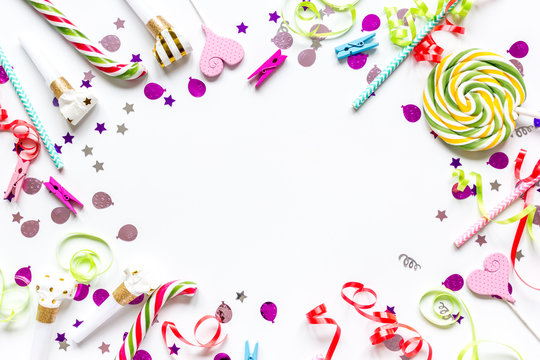 party set with lollipop and confetti on white background top view mock up