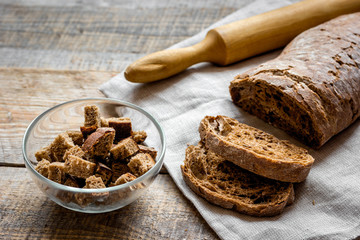 traditional bread with rolling-pin wooden table background