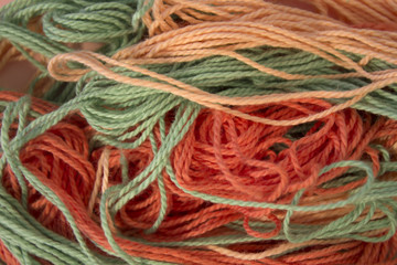 Pastel Orange and Green Cotton Embroidery threads background