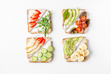 sandwiches set on white table background top view