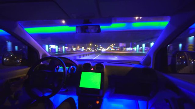 The Man Drive A Car In The City Highway. Inside View. Evening Night View, Green Screen Display, Real Time Capture