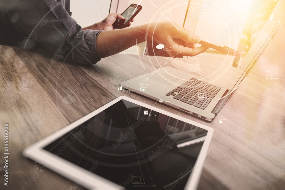 Poster creative working with mobile phone and digital tablet and laptop computer on wooden desk in modern o
