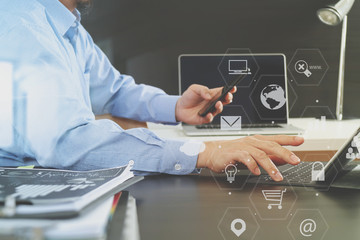 businessman working with smart phone and digital tablet and laptop computer in modern office
