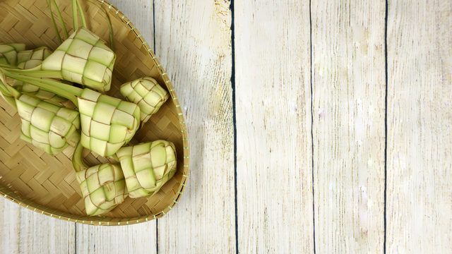 Ketupat On Wooden Background