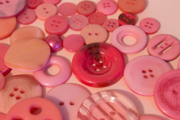Pink sewing buttons background