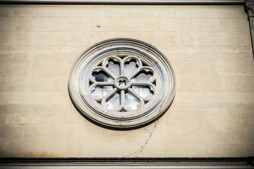 Fototapeta na wymiar Rose window of Nostra Signora del Sacro Cuore in Rome, Italy