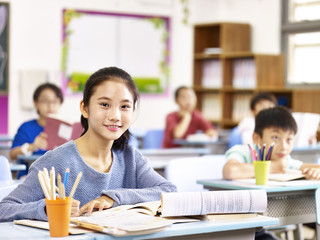 asian elementary schoolgirl in class at school. 