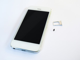 A white smart phone, sim card tray and small paper simulated as a SIM card on white background