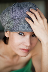 Asian woman in hat