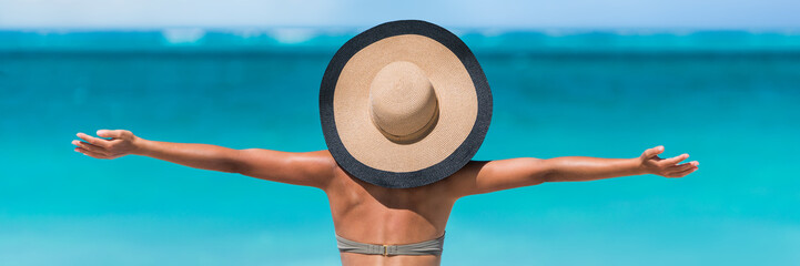 Beach vacation freedom summer travel holidays banner panorama. Woman in sun hat and bikini with...