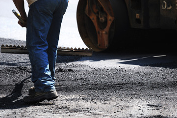 man working on road construction site