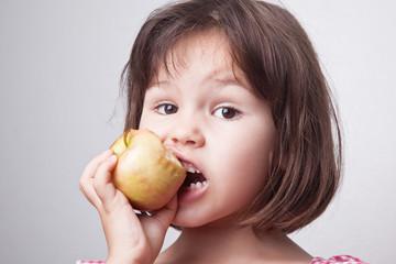 Girl biting an apple 