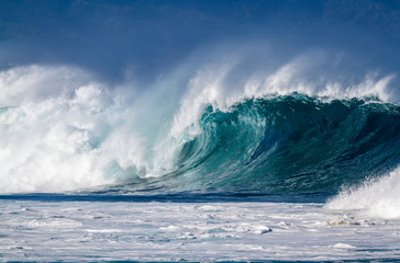A big breaking Ocean wave on the north shore of Oahu Hawaii - obrazy, fototapety, plakaty