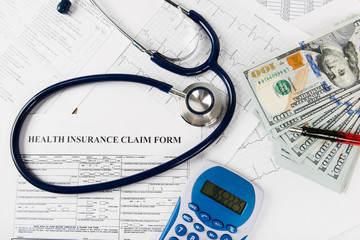  Stethoscope and calculator symbol for health care costs or medical insurance