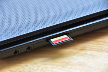sd card in slot with computer notebook.