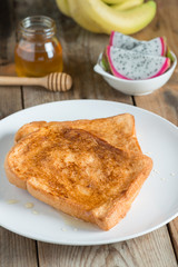 French toast with honey and fruit.