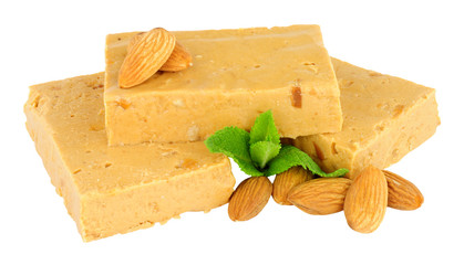 Soft nougat portions with almonds isolated on a white background