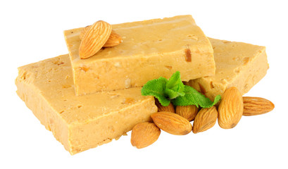 Soft nougat portions with almonds isolated on a white background
