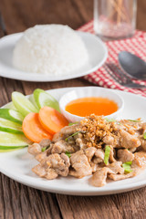 Fried pork with garlic and rice.