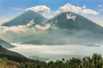 Foto op Canvas Landscape of volcanoes surrounding lake Atitlan in Guatemala. © Marek Poplawski