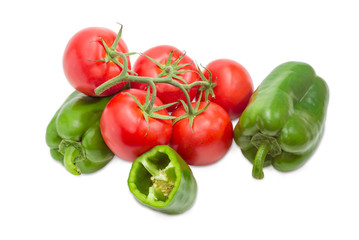 Branch of the ripe red tomatoes and green bell peppers