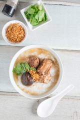 Rice porridge boiled pork ribs with shitake mushroom. Top view.