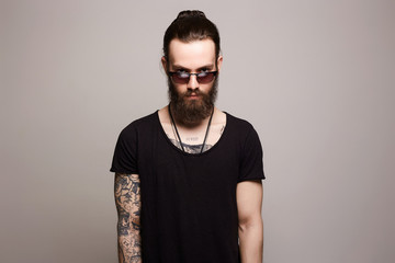 man with tattoo and sunglasses